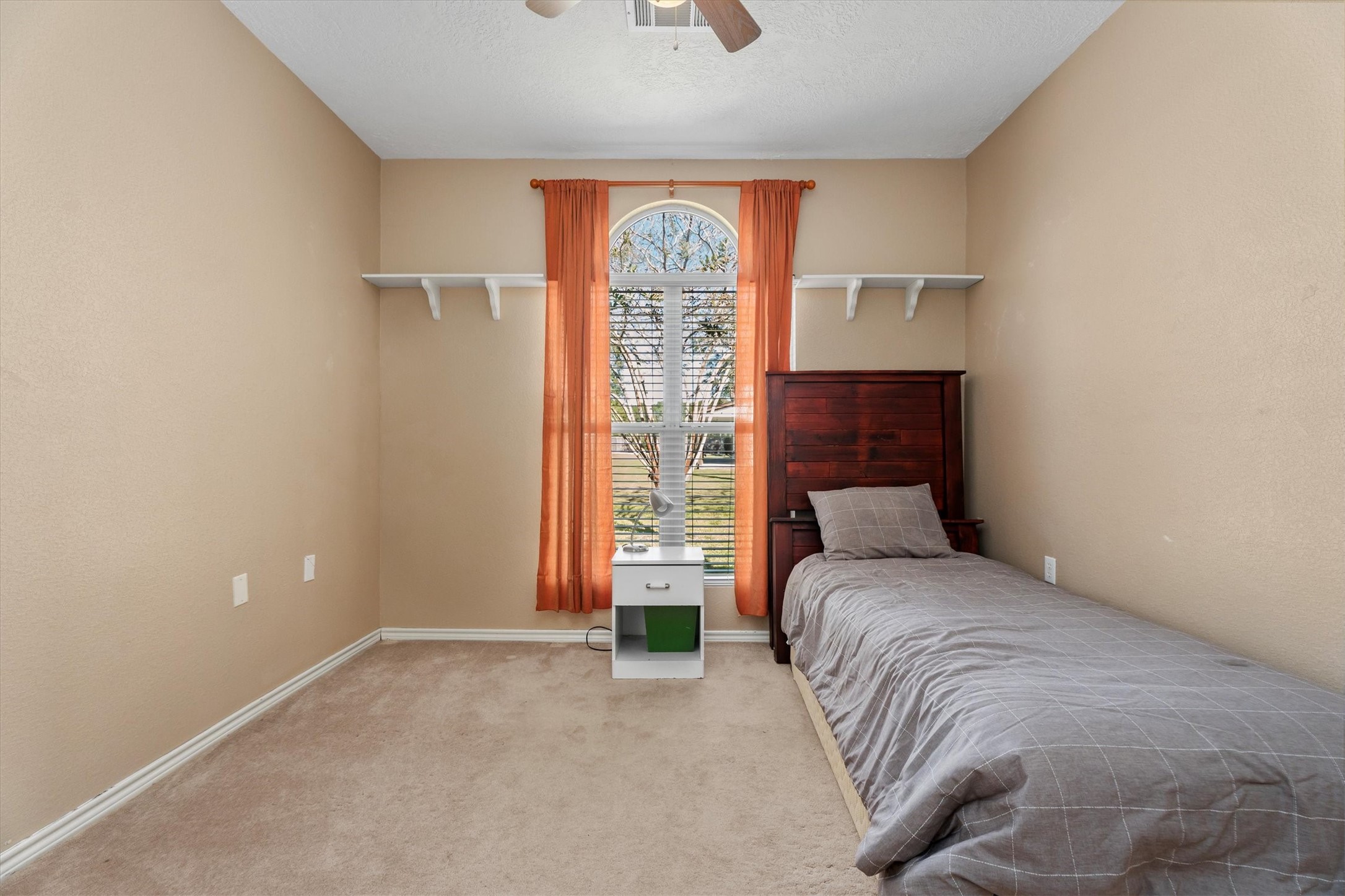 10205 Fostoria Road Cleveland, TX 77328 - Photo 19 of 44 a bedroom with a bed and a window