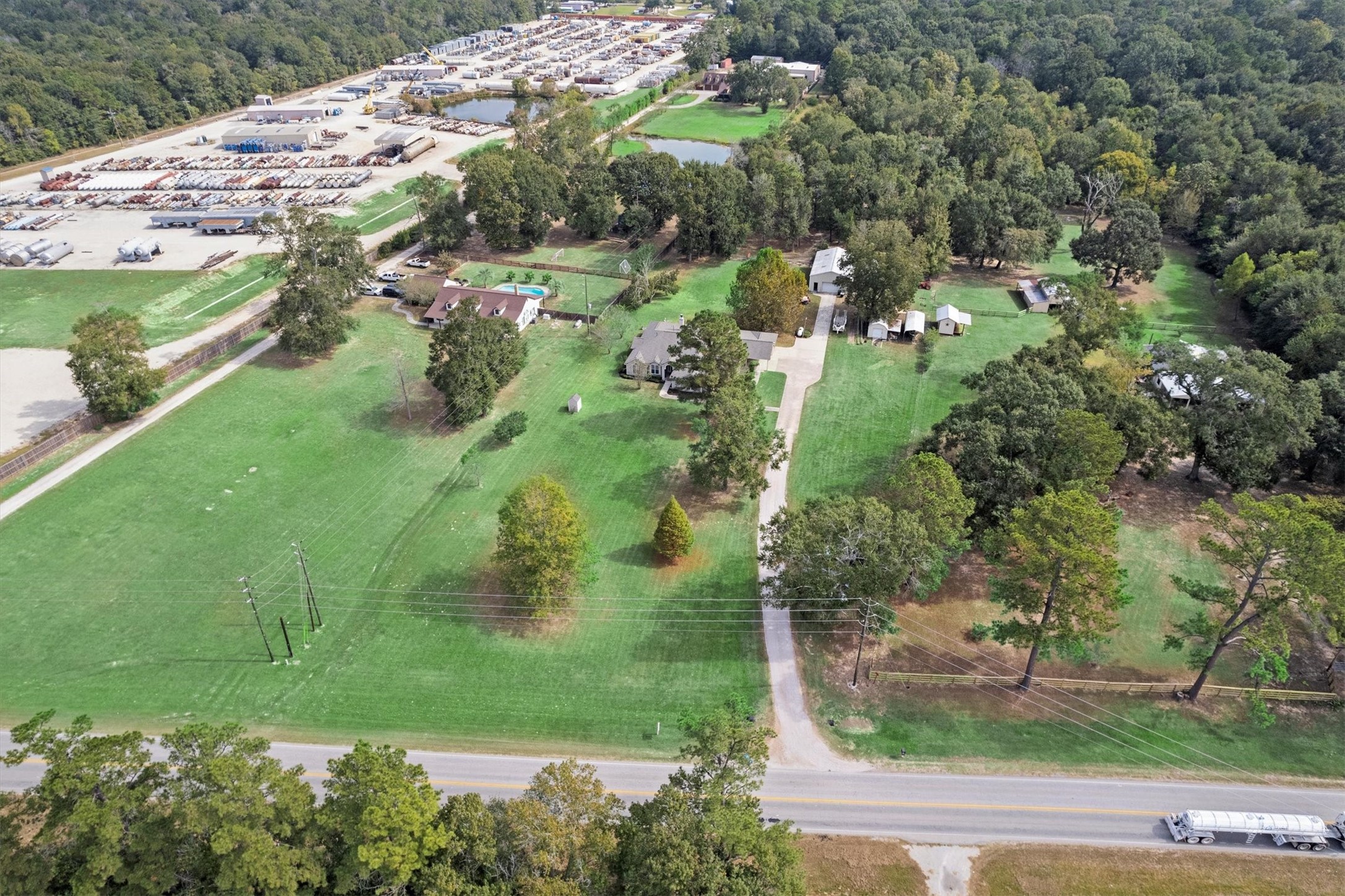 10205 Fostoria Road Cleveland, TX 77328 - Photo 2 of 44 an aerial view of residential houses with outdoor space and trees
