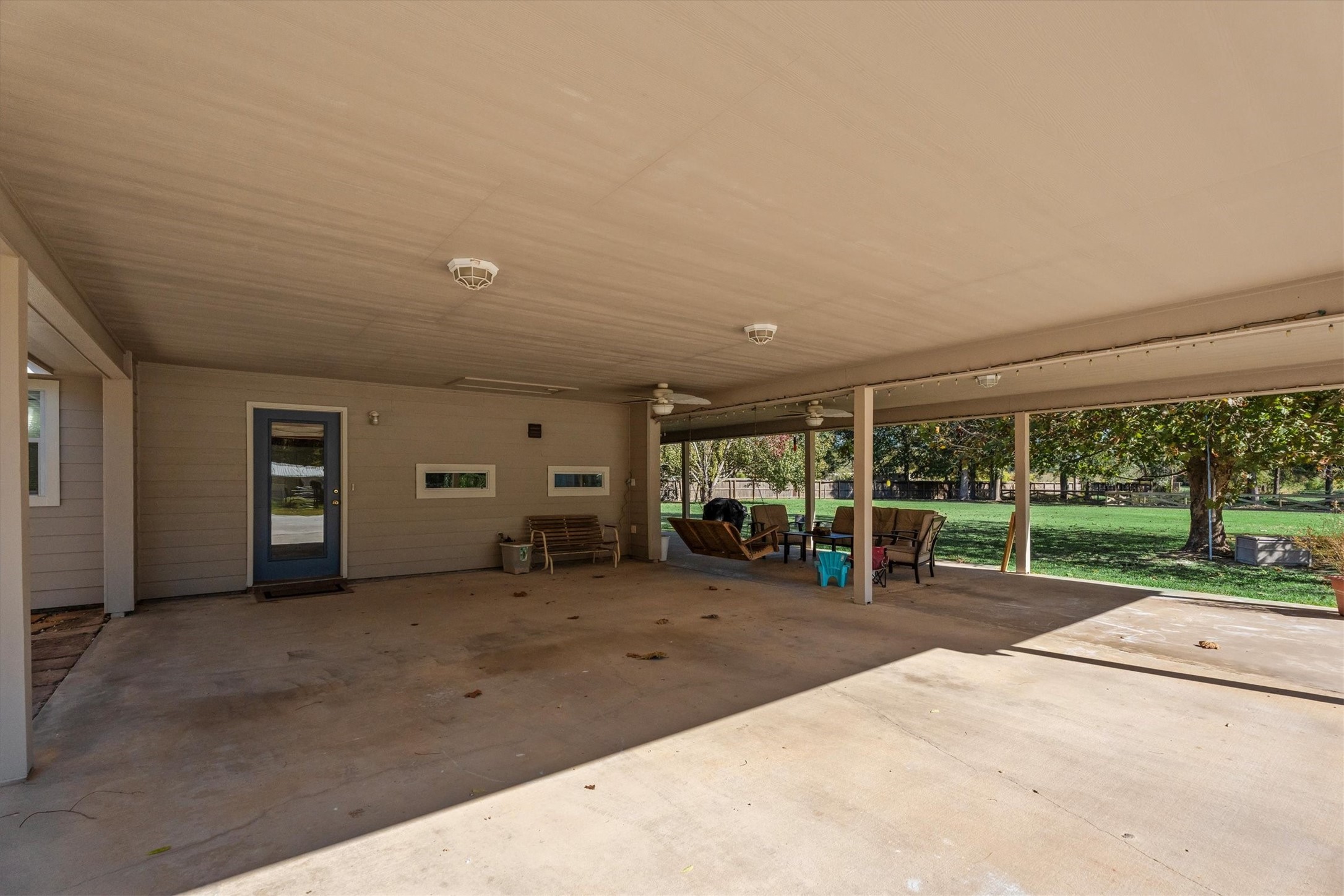 10205 Fostoria Road Cleveland, TX 77328 - Photo 35 of 44 a view of a room with gym equipment and large tree