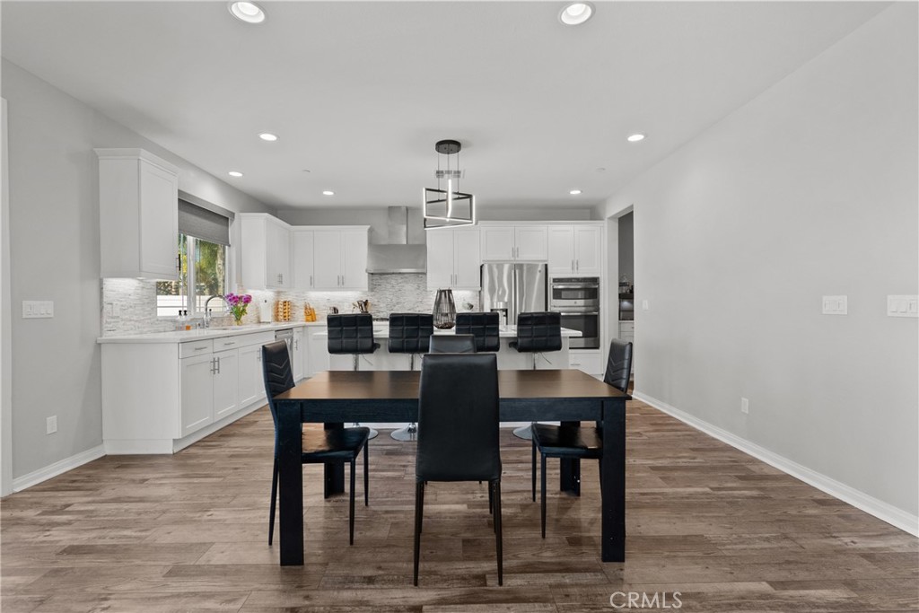 232 River Street Fillmore, CA 93015 - Photo 14 of 61 a dining room with kitchen island a table and chairs
