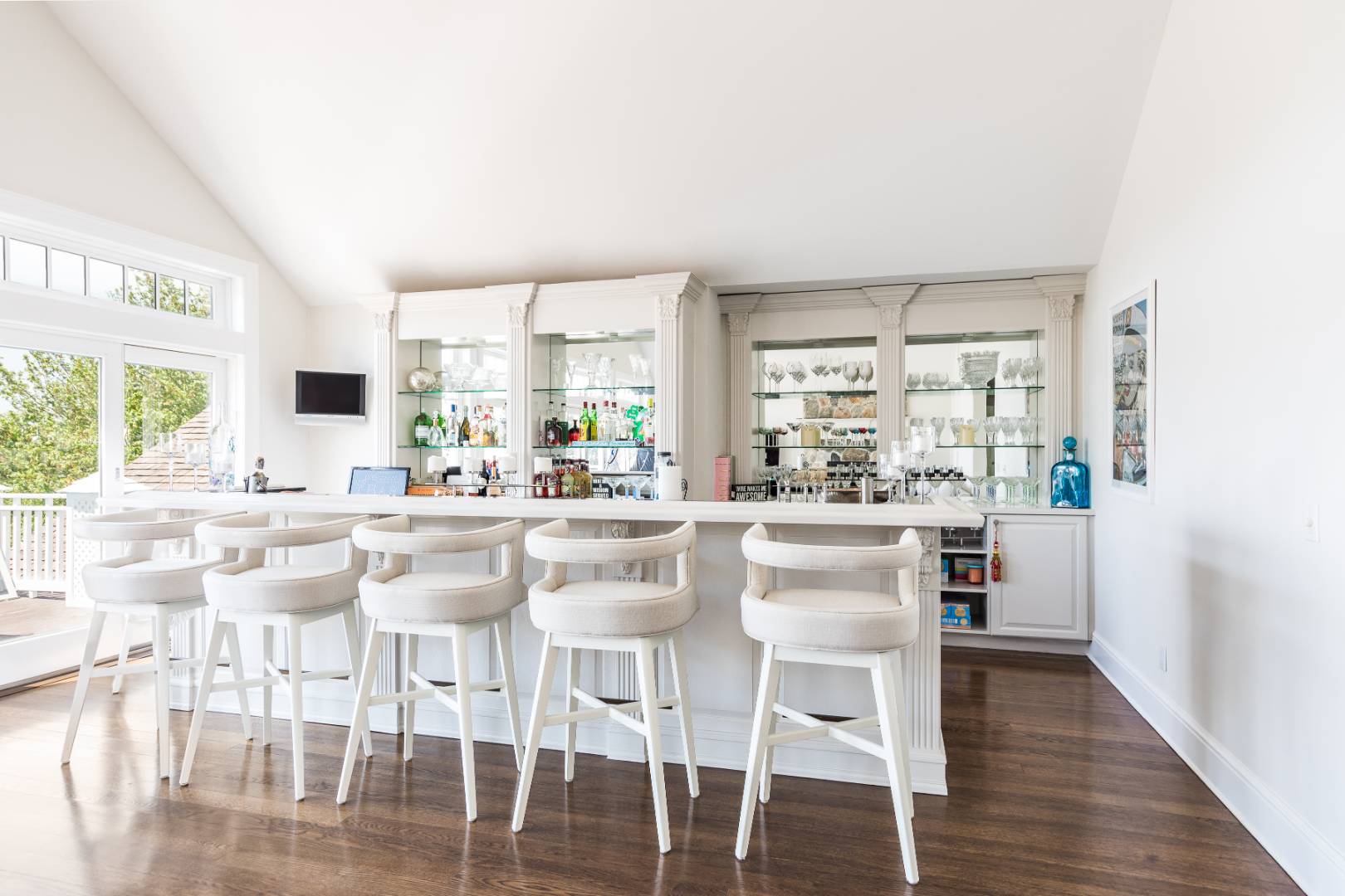 19 Kellis Way Bridgehampton, NY 11932 - Photo 11 of 26 a kitchen with stainless steel appliances kitchen island wooden floors and white cabinets