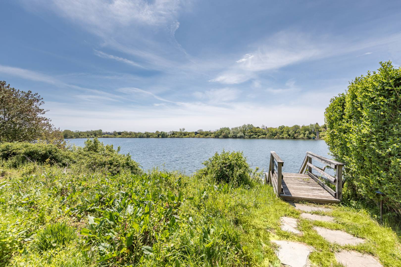 19 Kellis Way Bridgehampton, NY 11932 - Photo 3 of 26 a view of a lake with houses in the back