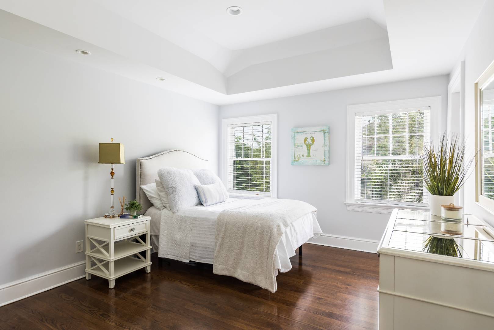 19 Kellis Way Bridgehampton, NY 11932 - Photo 21 of 26 a bedroom with a bed and wooden floor