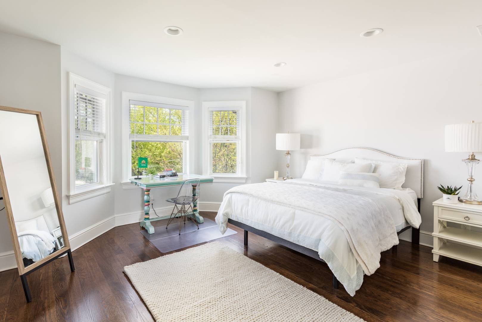 19 Kellis Way Bridgehampton, NY 11932 - Photo 22 of 26 a bedroom with a bed and a large window