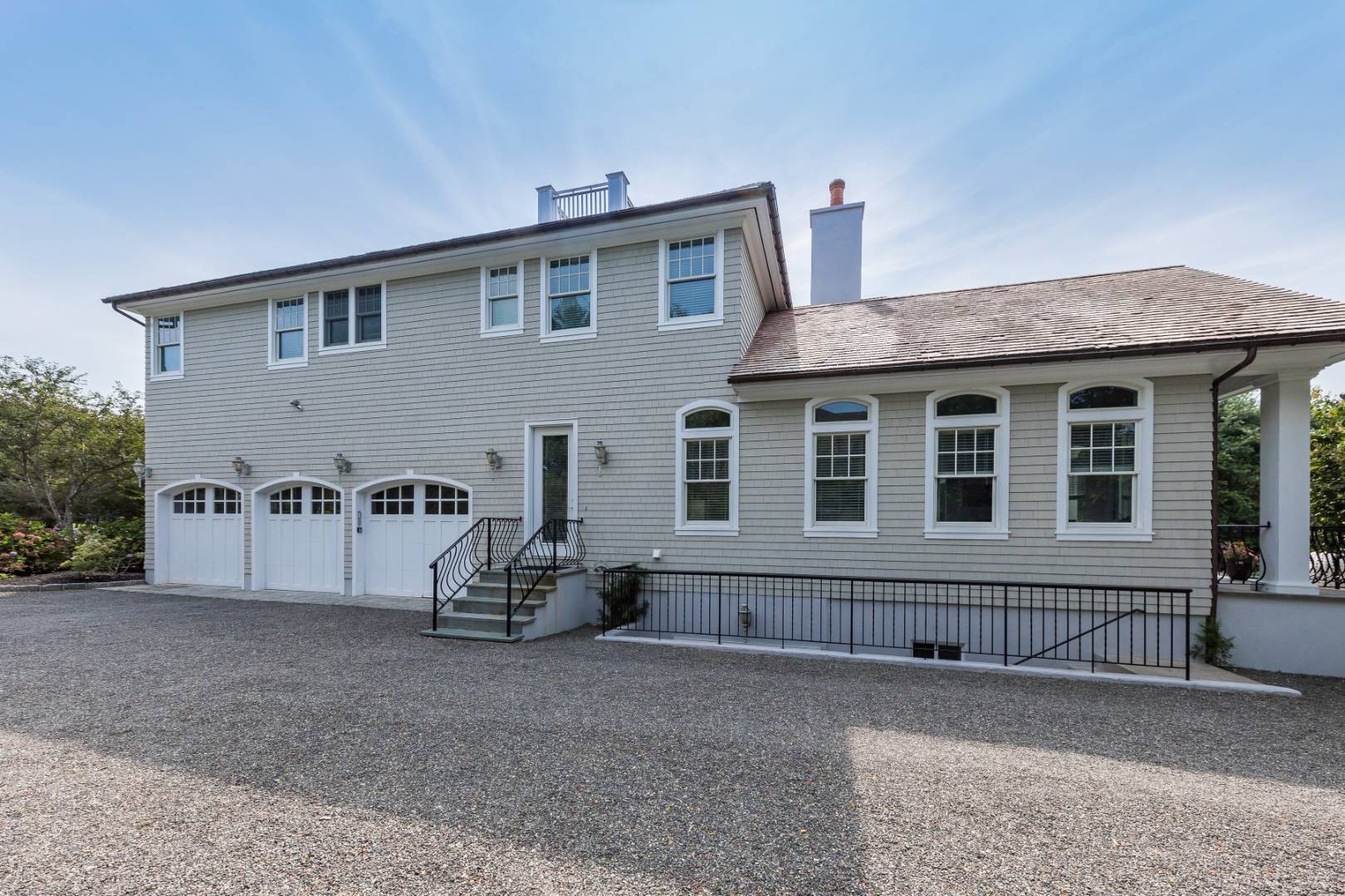 19 Kellis Way Bridgehampton, NY 11932 - Photo 25 of 26 a view of a house with a yard and a large window