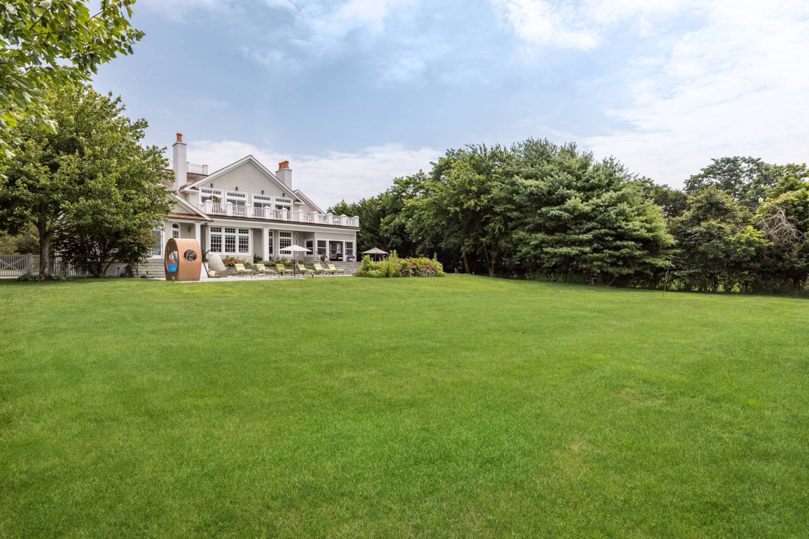 19 Kellis Way Bridgehampton, NY 11932 - Photo 4 of 26 a view of a house with a big yard and large trees