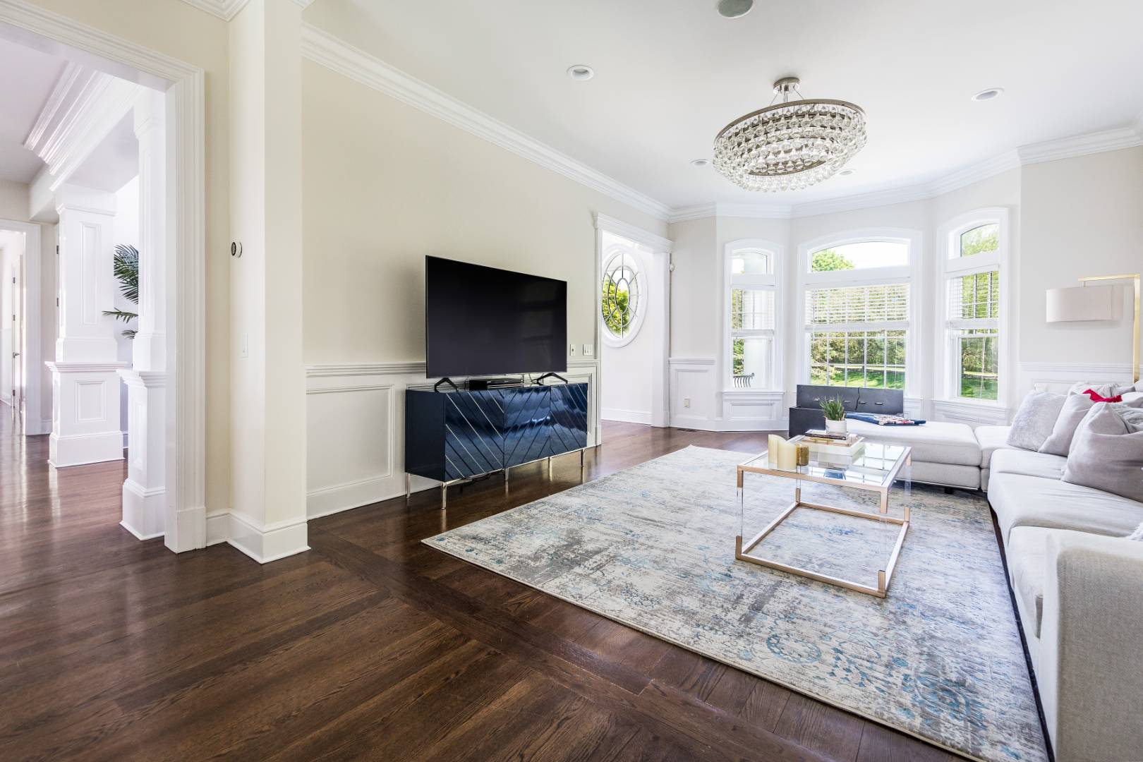 19 Kellis Way Bridgehampton, NY 11932 - Photo 6 of 26 a living room with furniture and a flat screen tv