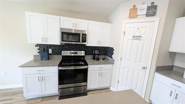 a living room with furniture a window and a table