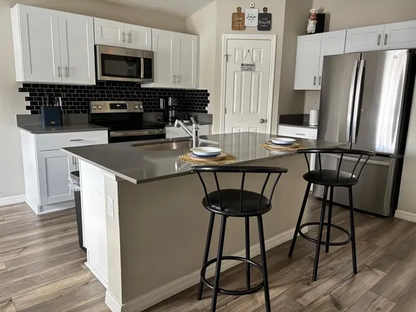 a living room with furniture and a gate