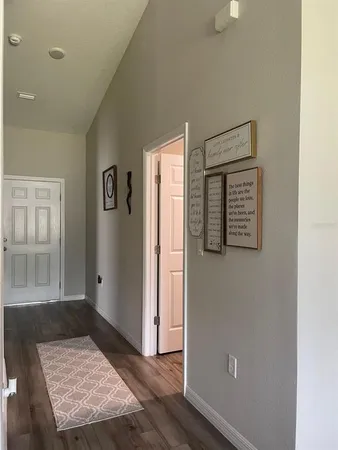 a bedroom with a bed and a mirror