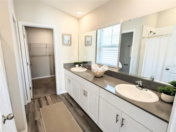 a bedroom with bed and window