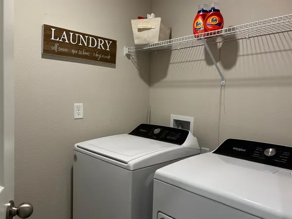a view of a room with a wooden floors
