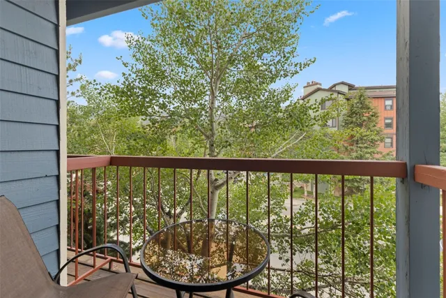 a view of a balcony with chairs
