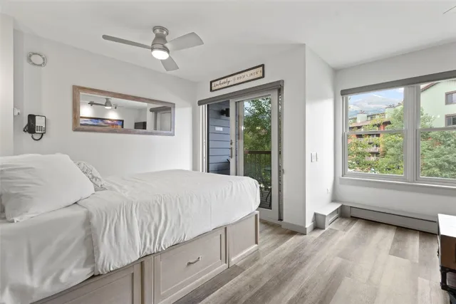 a bedroom with a large bed and a window