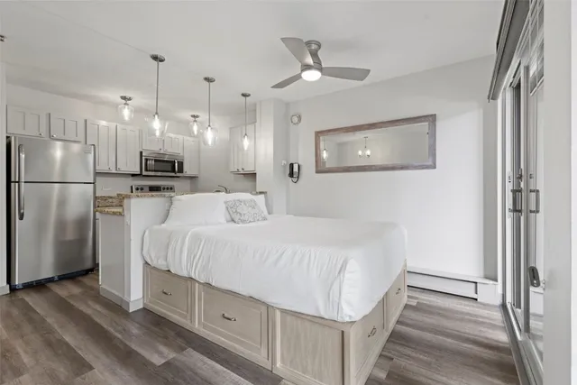 a large white bed in a white room