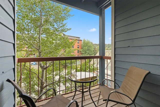 a view of a balcony with chairs