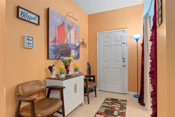 a view of a entryway with furniture and chandelier