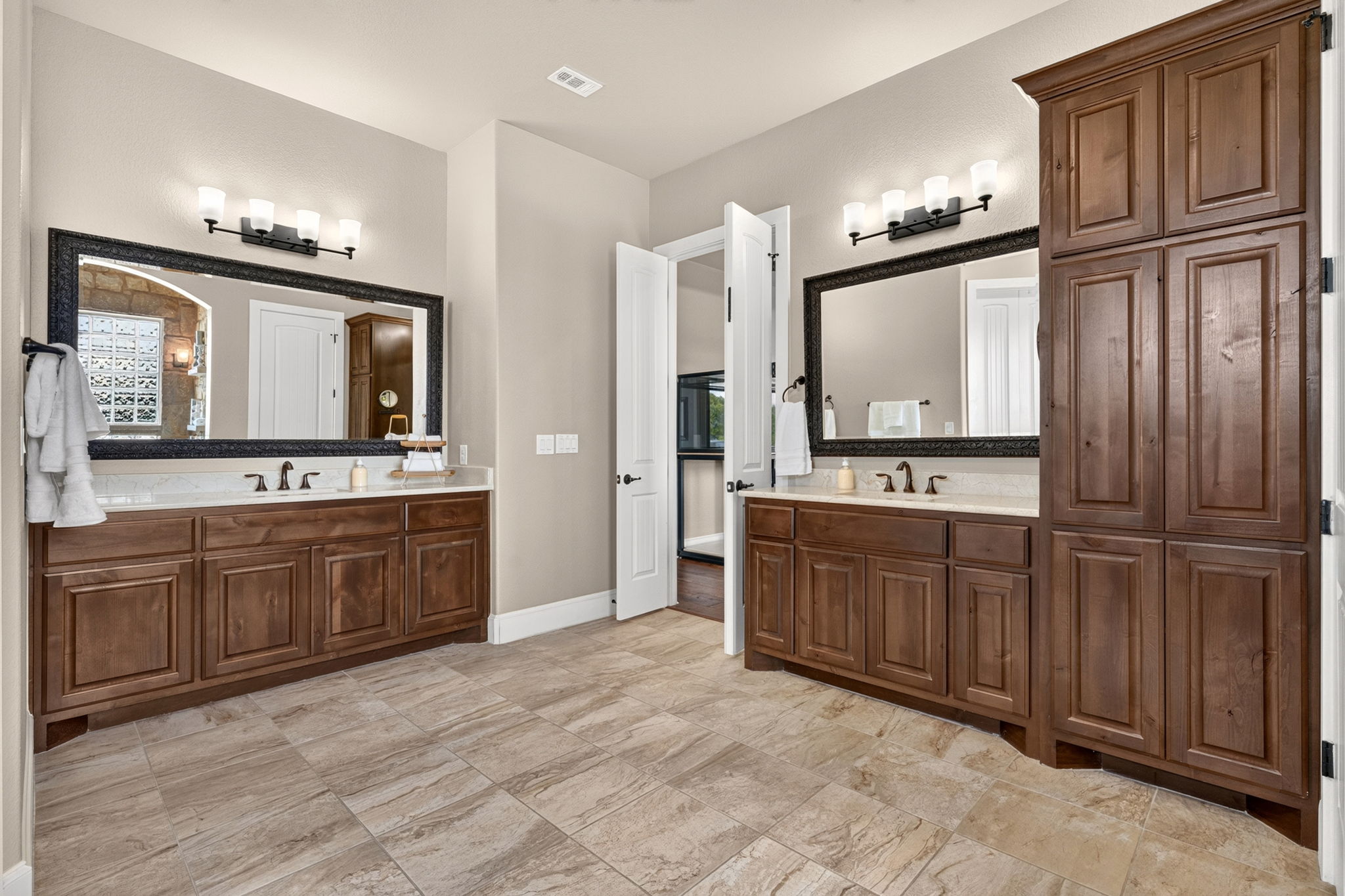 105 Coopers Hill Road Georgetown, TX 78633 - Photo 22 of 40 a spacious bathroom with a granite countertop sink and a mirror