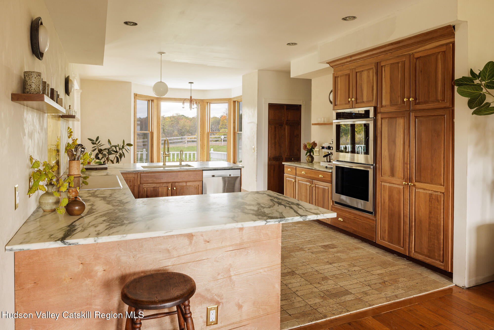 191 Farm To Market Road Athens, NY 12015 - Photo 8 of 31 a kitchen with stainless steel appliances granite countertop a sink refrigerator and cabinets