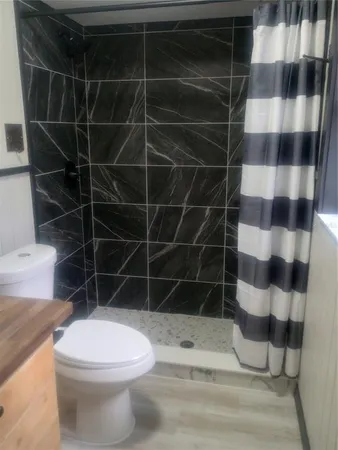 a bathroom with a toilet and a sink