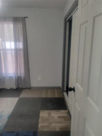 a view of an empty room and window