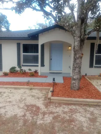 a front view of a house with garage