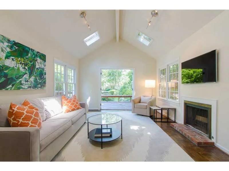 1916 Greystone Road Northwest Atlanta, GA 30318 - Photo 13 of 24 a living room with furniture and a fireplace