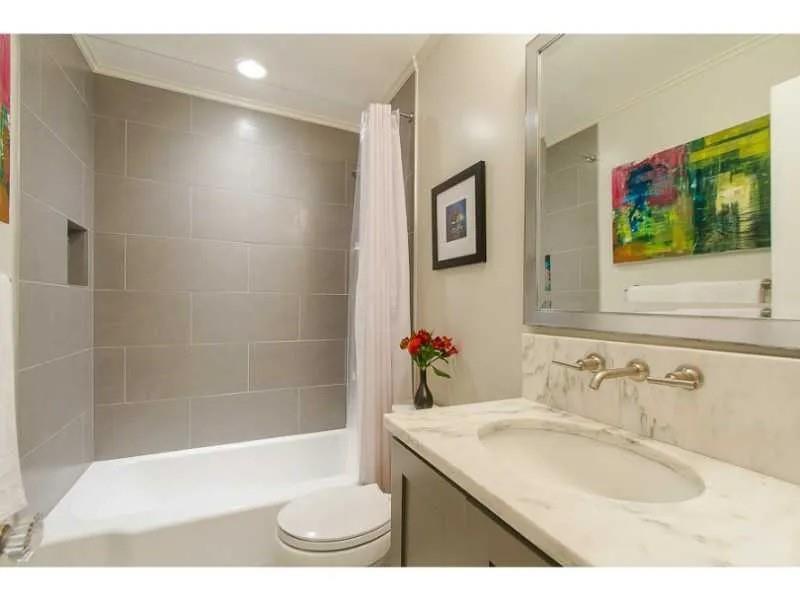 1916 Greystone Road Northwest Atlanta, GA 30318 - Photo 15 of 24 a bathroom with a sink a toilet and shower