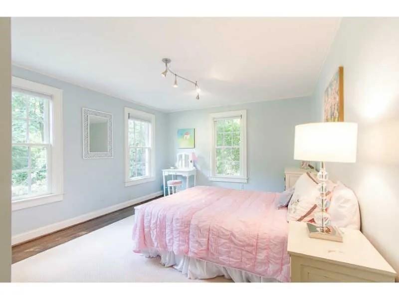 1916 Greystone Road Northwest Atlanta, GA 30318 - Photo 16 of 24 a bedroom with a bed and a window