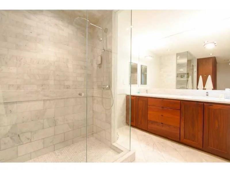 1916 Greystone Road Northwest Atlanta, GA 30318 - Photo 18 of 24 a bathroom with a sink and a mirror