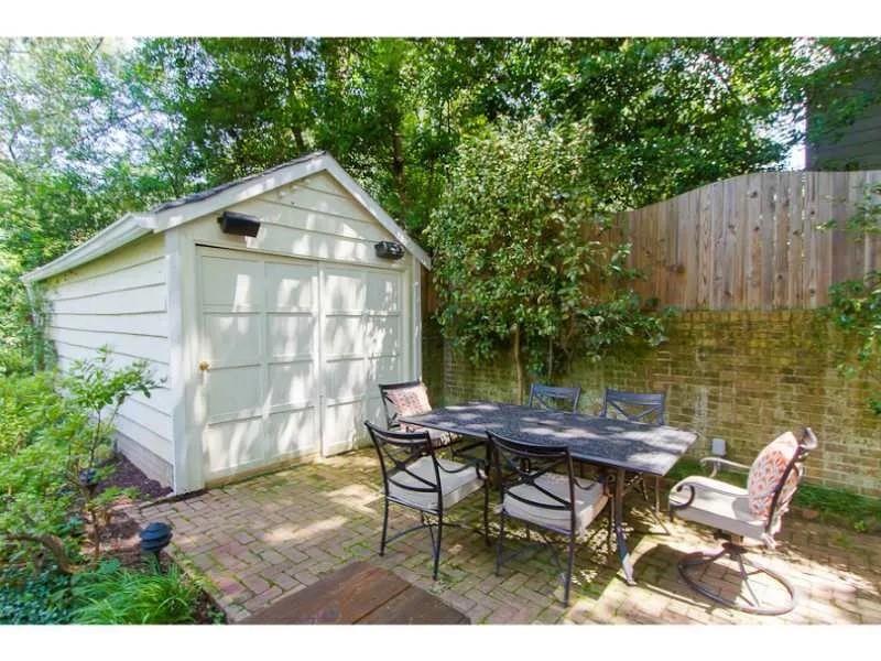 1916 Greystone Road Northwest Atlanta, GA 30318 - Photo 21 of 24 a view of a chairs and table in backyard of the house