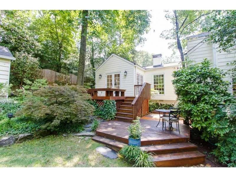 1916 Greystone Road Northwest Atlanta, GA 30318 - Photo 23 of 24 a view of a house with backyard sitting area and garden