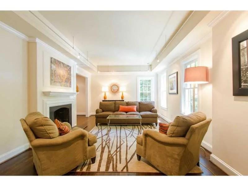 1916 Greystone Road Northwest Atlanta, GA 30318 - Photo 4 of 24 a living room with furniture a fireplace and a large window