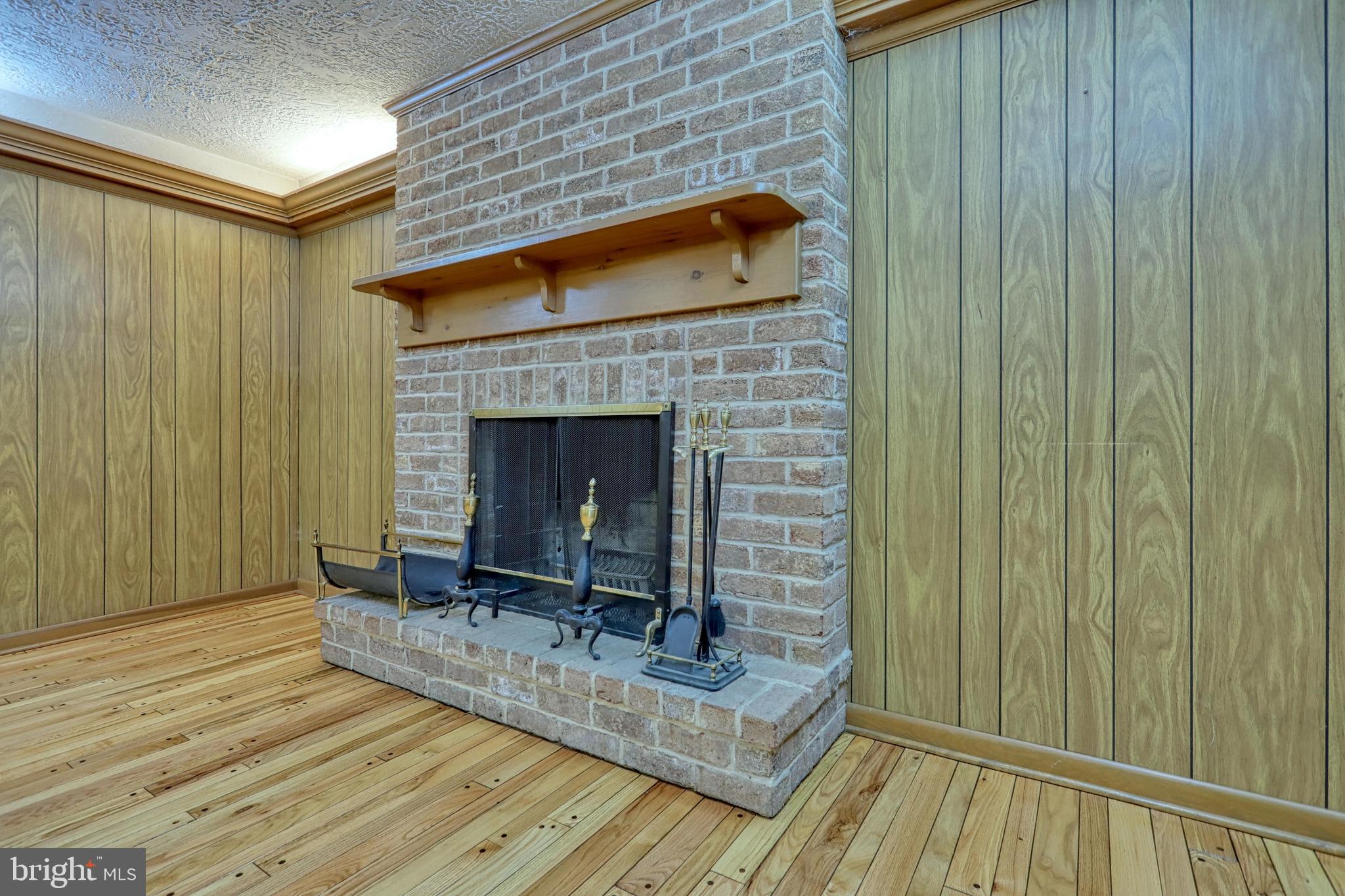3420 Harrowgate Road York, PA 17402 - Photo 23 of 41 Pegged hardwood floors - wood burning fireplace