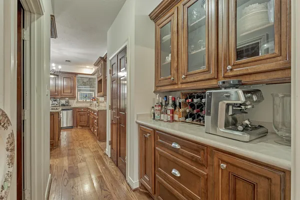 a kitchen with stainless steel appliances granite countertop a refrigerator and cabinets
