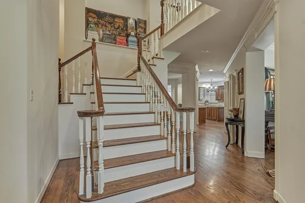 a view of entryway and hall with wooden floor