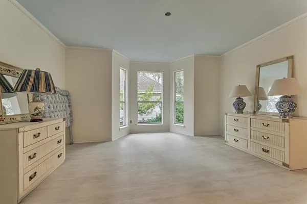 a room with a dresser and a mirror