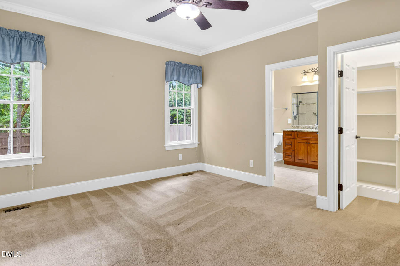 2209 Lodestar Drive Raleigh, NC 27615 - Photo 14 of 50 wooden floor in an empty room with a window