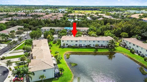 an aerial view of a house with a lake view