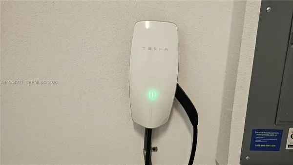 an aerial view of a house with a ocean view