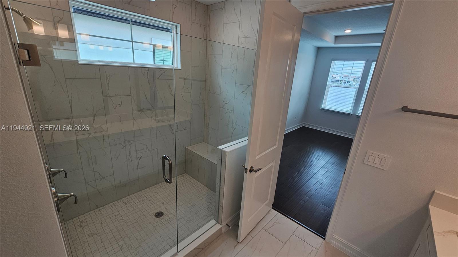 1112 Seagrape Drive Ruskin, FL 33570 - Photo 5 of 18 a bathroom with a glass door shower