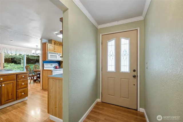 a view of kitchen with furniture and wooden floor