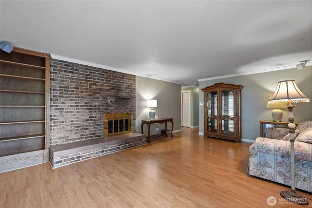 a view of a livingroom with furniture and a fireplace