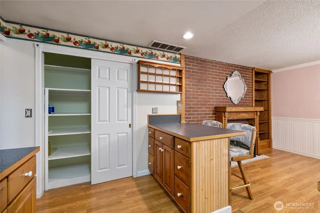 a kitchen with a cabinets and a stove top oven