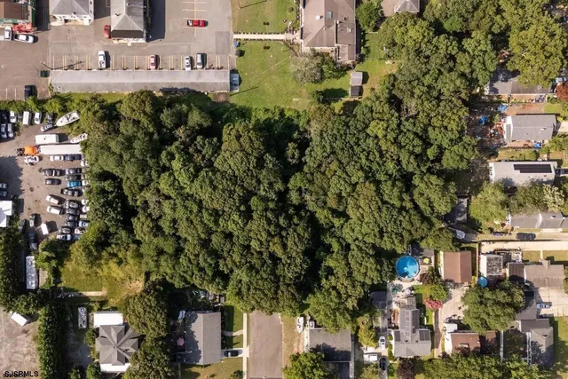 an aerial view of a residential apartment building with a yard
