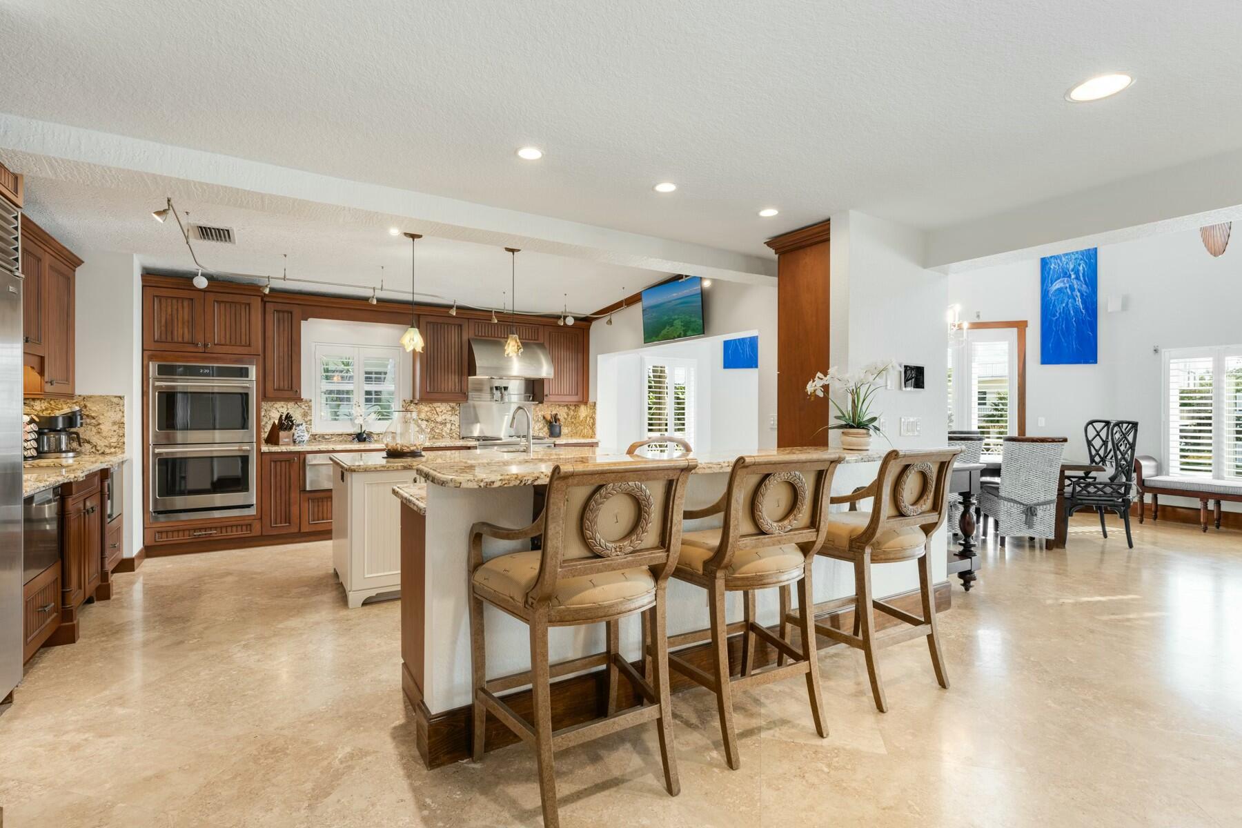 141 Canal Street Tavernier, FL 33070 - Photo 20 of 90 a large kitchen with a table and chairs