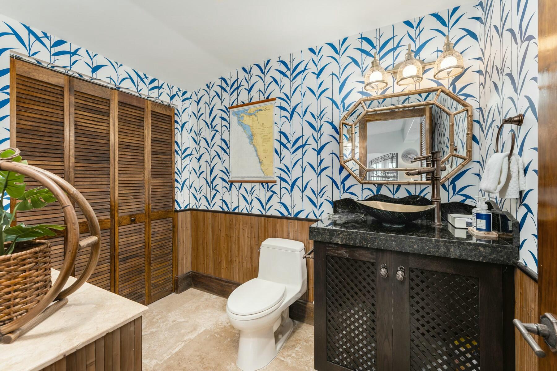141 Canal Street Tavernier, FL 33070 - Photo 22 of 90 a bathroom with a granite countertop sink and a toilet
