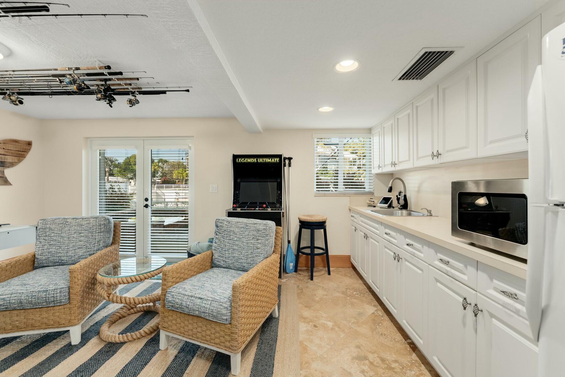 141 Canal Street Tavernier, FL 33070 - Photo 55 of 90 a living room with furniture and a flat screen tv