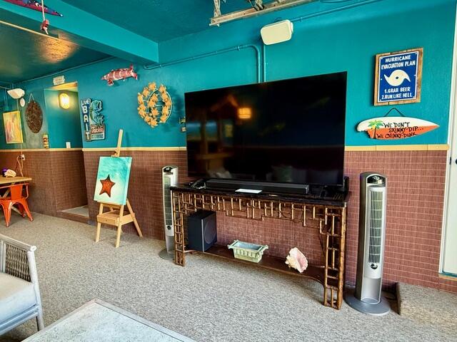 141 Canal Street Tavernier, FL 33070 - Photo 65 of 90 a living room with furniture and a flat screen tv