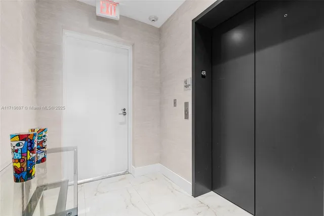 a living room with furniture potted plant and a large window